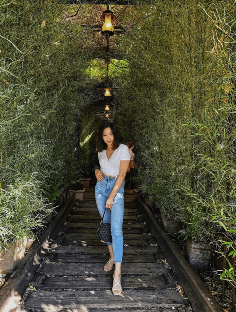female surrounded by plants